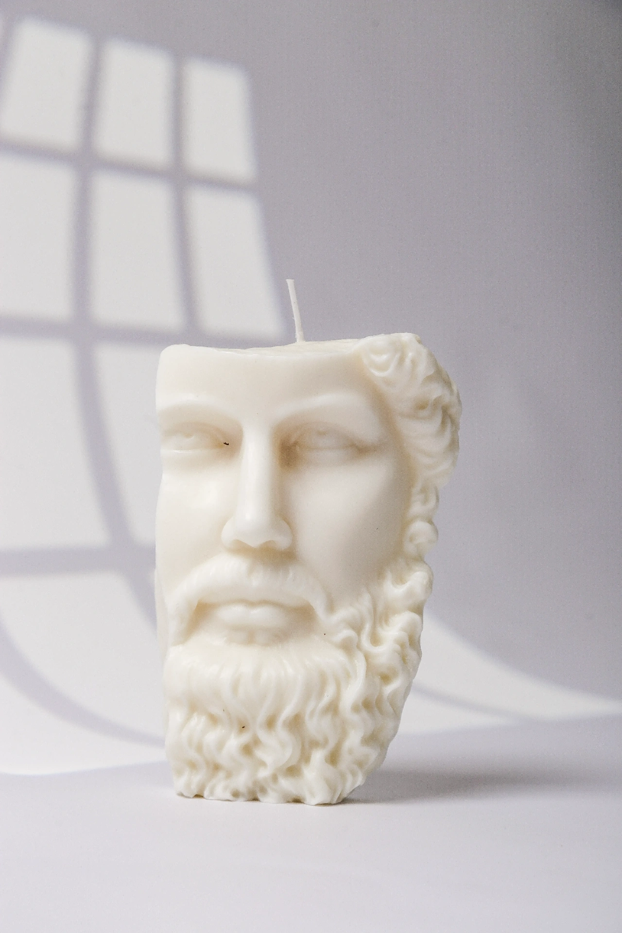 Fotografía de productos en São Paulo — fotografía de Vela artesanal Amber escultural busto grego com barba